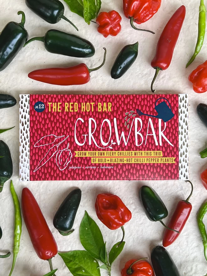 The Red Hot Growbar surrounded by spicy jalapeno, scotch bonnet and red chillies. 