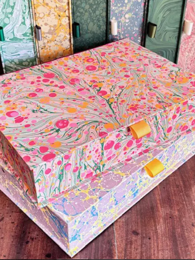 Box File. A stack of pink box files.
