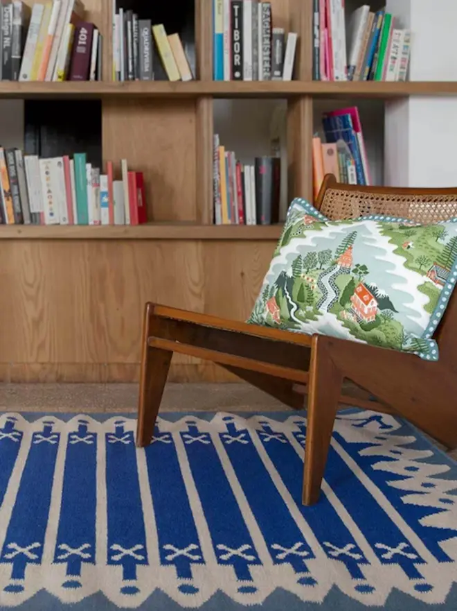 Darjeeling Flatweave Rug, a colourful rug on a plain surface. 