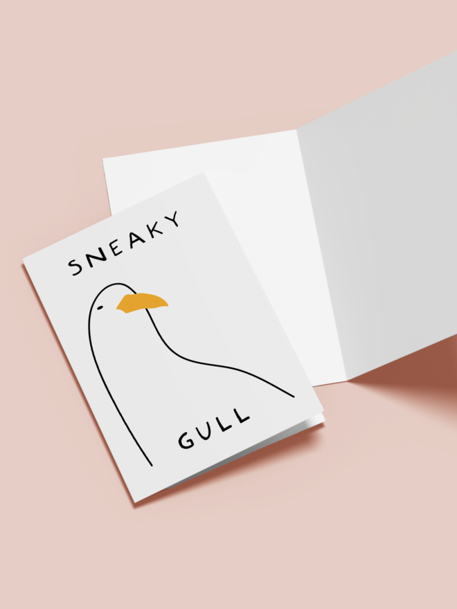 'sneaky gull' card.  a white card with an illustrated seagull. 