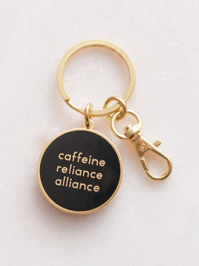 Caffeine reliance alliance enamel keyring
