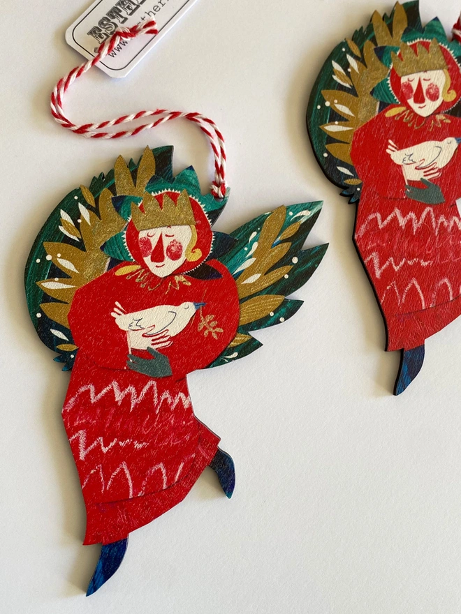 Red and green illustrated angel decoration by Esther Kent