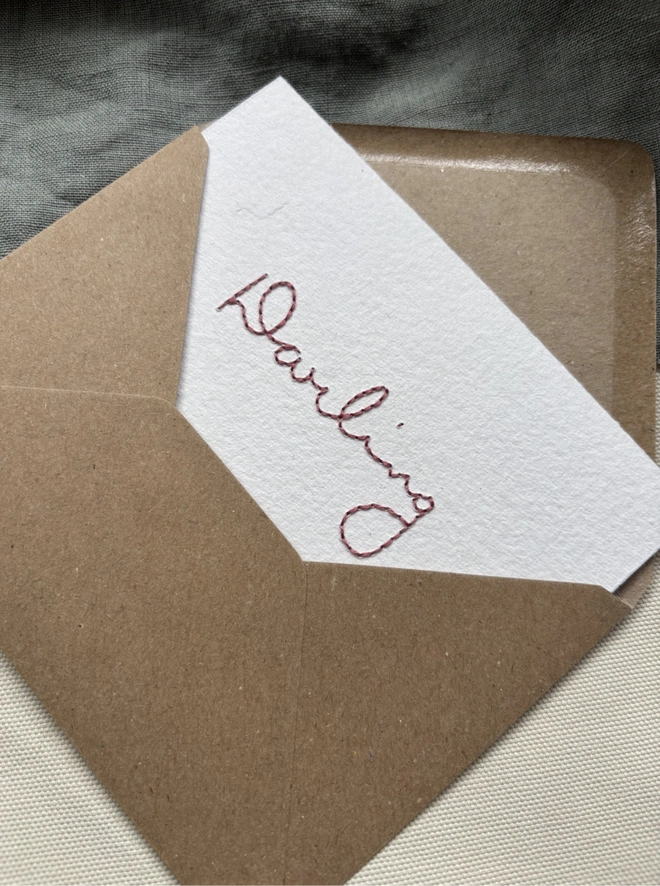 Darling hand embroidered lettering hand stitched in dusky pink thread on white khadi paper with envelope