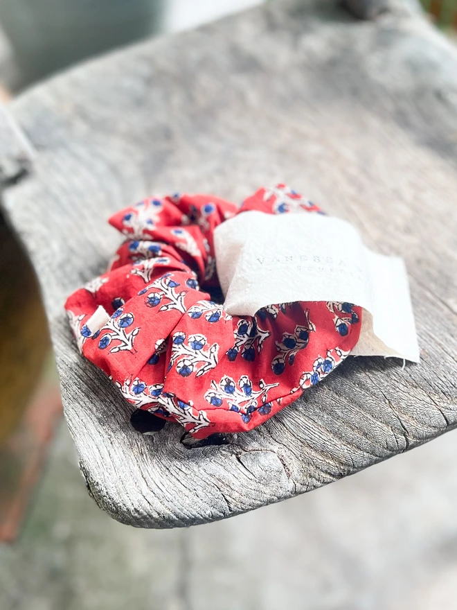 Red Blue Block Printed Hair Tie Scrunchie On A Chair In The Sun