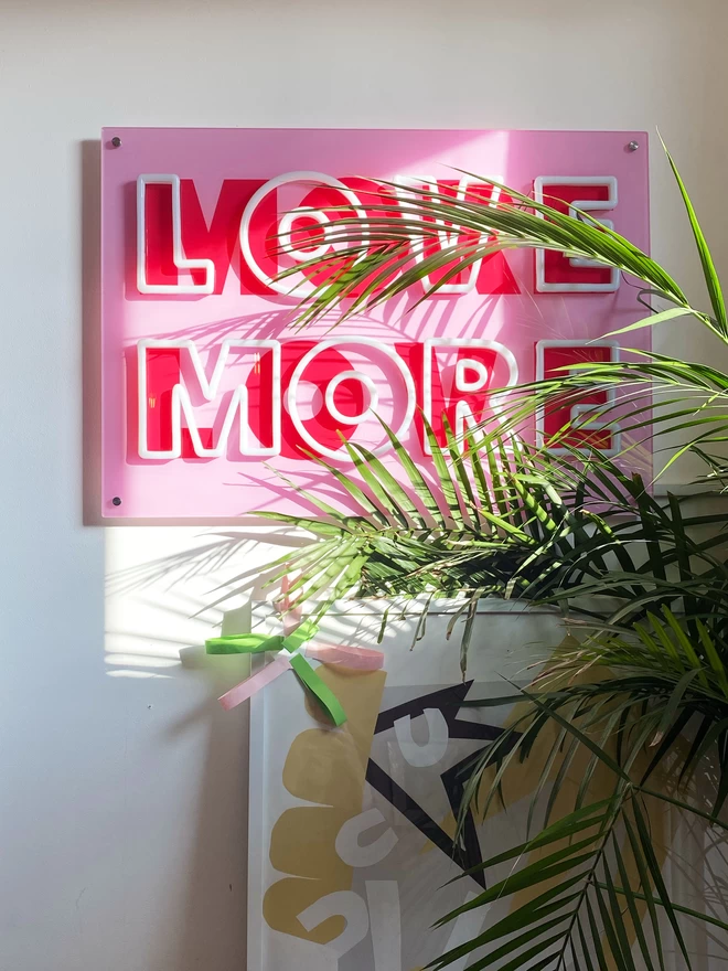 'Love More More Love' neon switched off