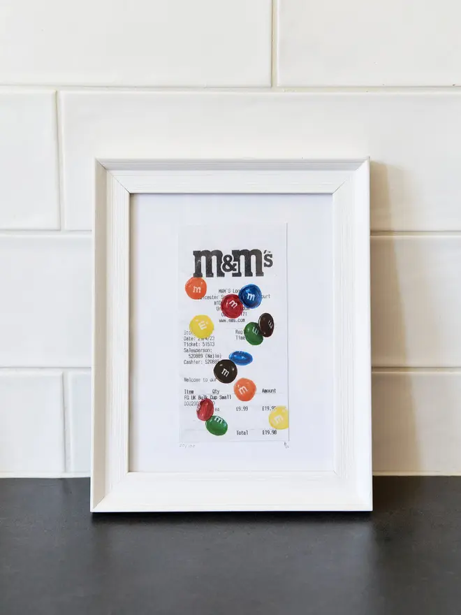 M&M Receipt print in a white frame 