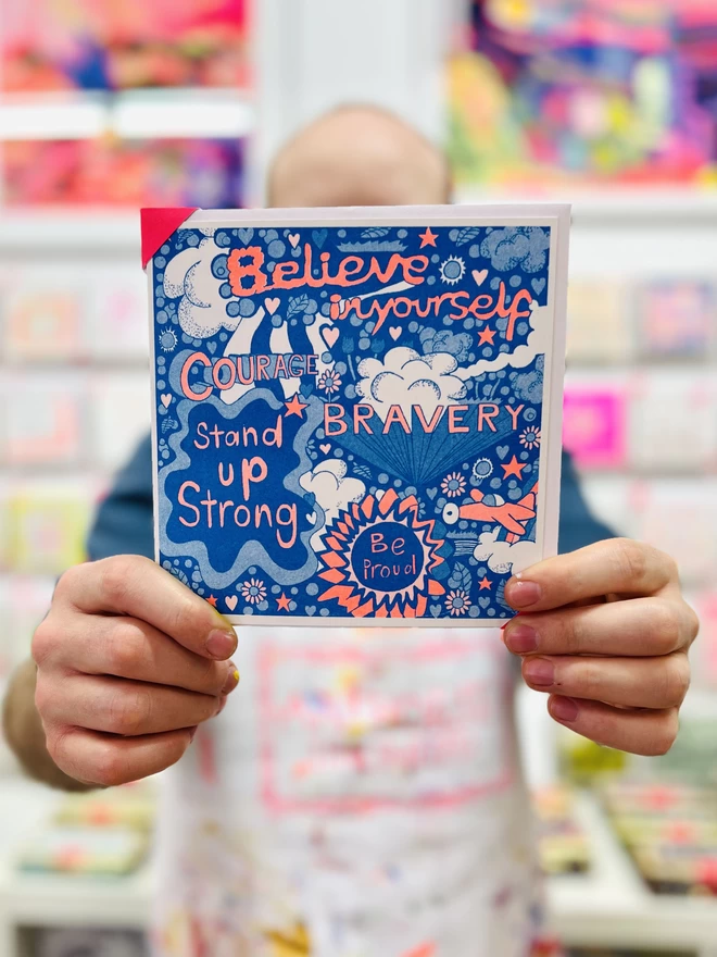 A riso printed charity card called Believe In Yourself with positive affirmations in bright colours