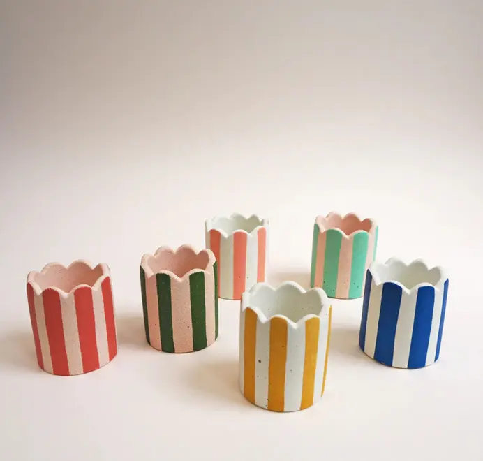 Mini Scalloped Stripy Plant Pot. Five small white ceramic pot with vertical coloured stripes set against a plain light background.