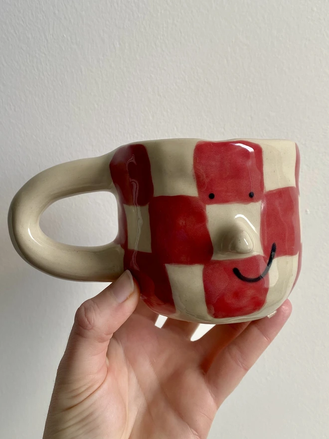 red checkerboard mug front
