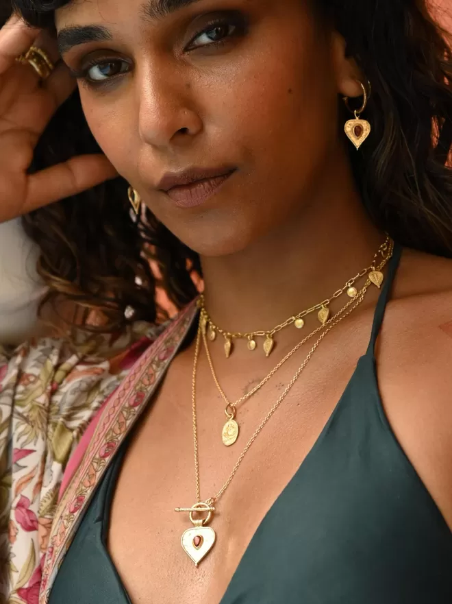 Model wearing Loft & Daughter layering necklaces in gold vermeil