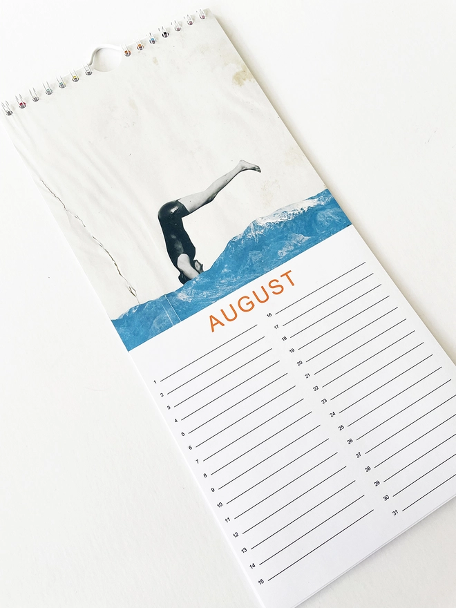 The August page of a perpetual celebration calendar featuring a swimmer diving into snowy mountains.