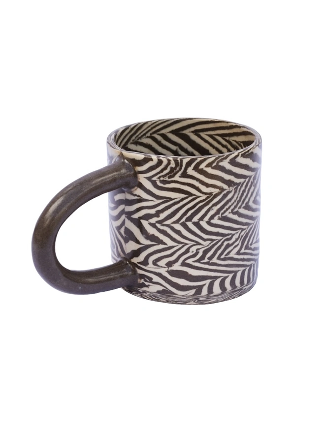 Herringbone Chunky Mug, a colourful mug sitting on a white surface against a plain backdrop. 