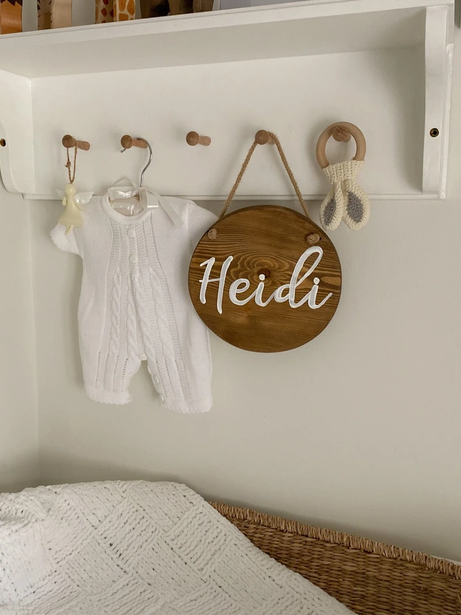 round wooden name sign