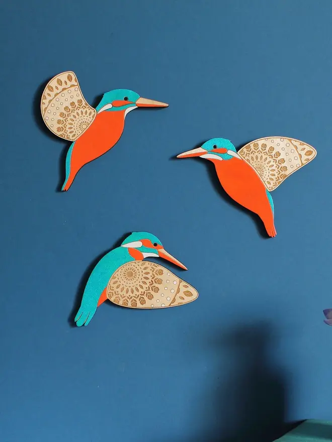 Folk Art Wooden Kingfishers (Set Of 3), wooden kingfishers hanging flying on a wall. 