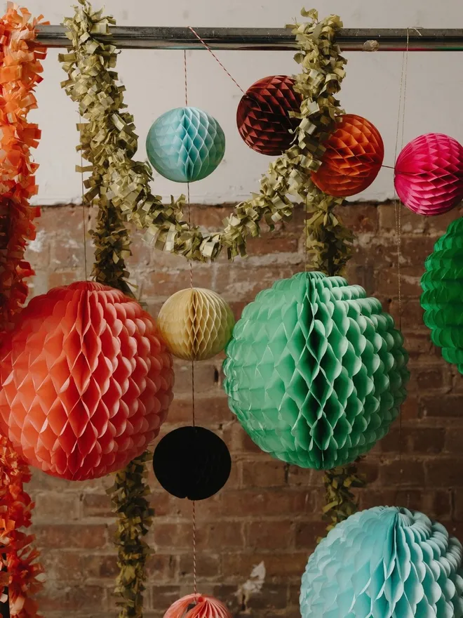 Paper decorations hanging on a rail 