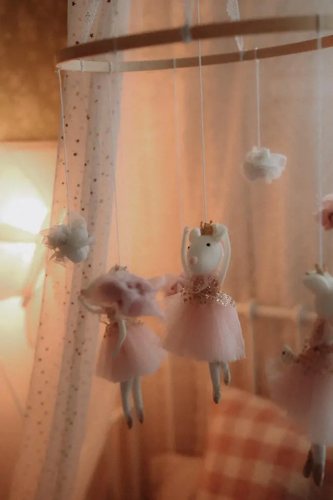 Hanging Mice Ballerina Felt Carousel Decoration, a hanging mice carousel decoration suspended in a child's decorated bedroom. 