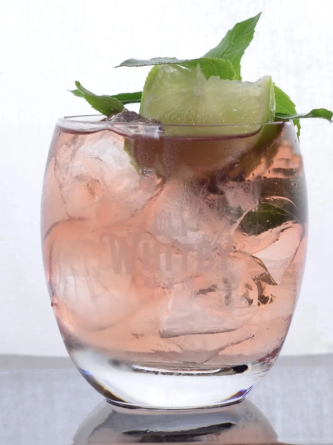 Bramble & Bay Edition Gin, a glass of gin sitting on a plain white surface. 