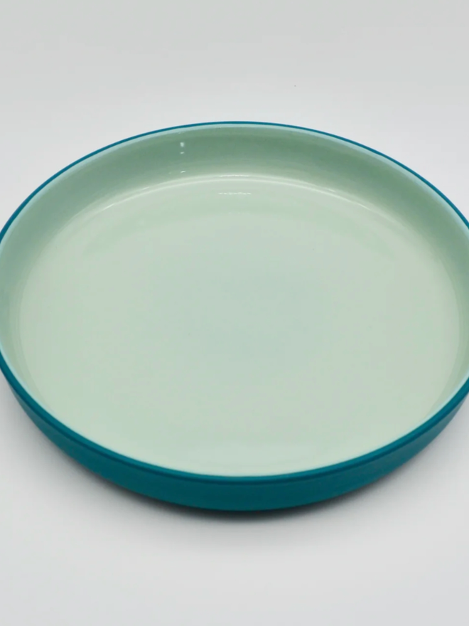 Serving Plate. A green serving plate with lighter green interior.