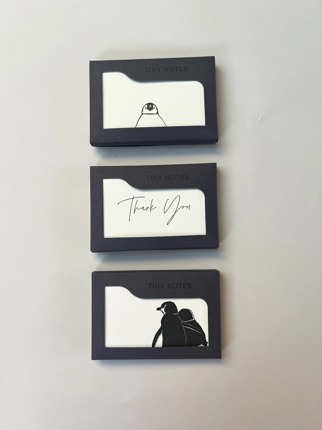 set of boxed letterpress tiny note cards illustrated with penguins and modern calligraphy