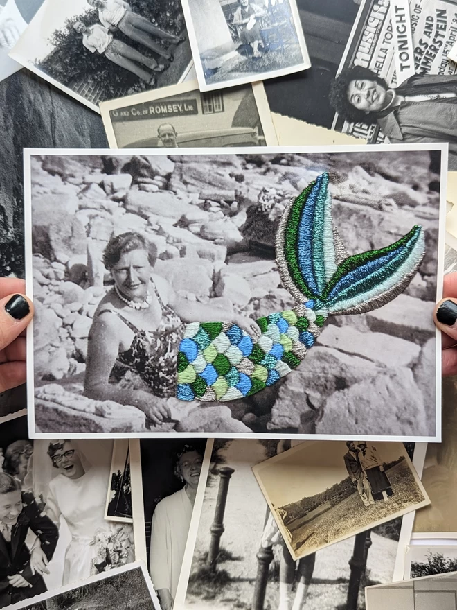 B&W image of women with embroidered mermaid tail held against photos