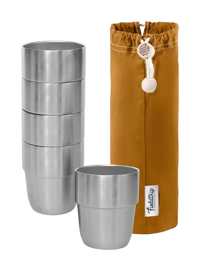 willow complete picnic hamper. a stack of stainless steel cups with a mustard yellow cloth bag.