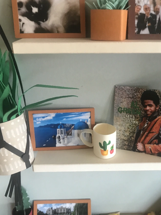 a wooden box with miniatures of the person favourite things inside. Each piece is handmade specially on request. bespoke art piece made by My Papercut Forest