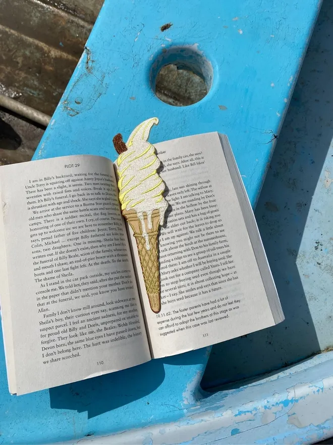 Ice cream embroidered bookmark in book on a boat