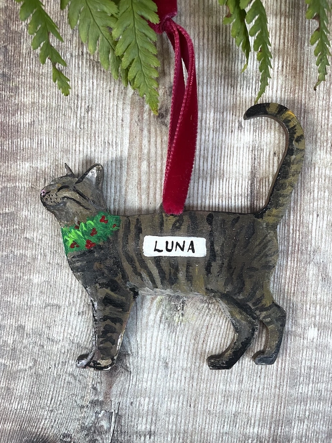 Tabby Cat Hand-painted personalised Christmas decoration with the name Luna and hung with red velvet ribbon