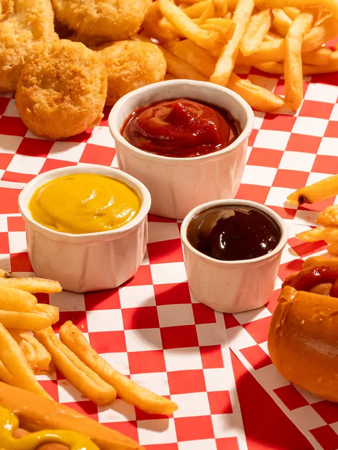 Complete Sauce Pot Bundle (Set Of 3), with sauce poured into them. 