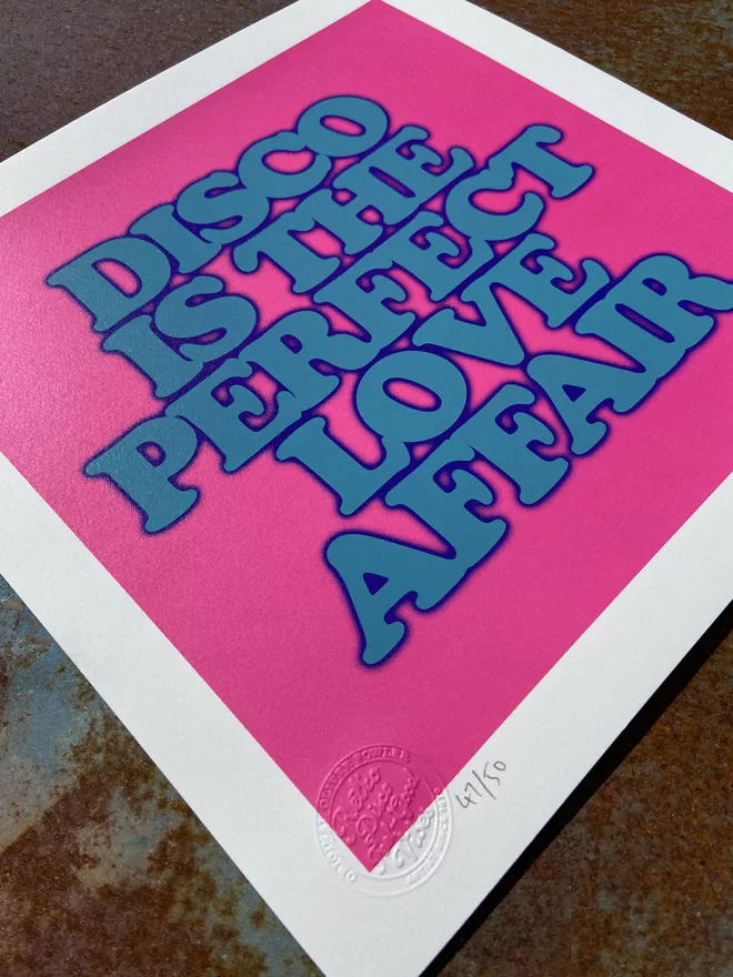 "Disco Is The Perfect Love Affair" Mini Screen Print with pink background and the words disco is the perfect love affair printed on top in blue 