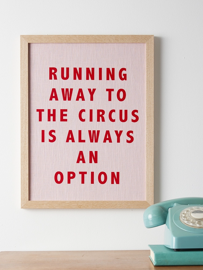 Running away to the circus is always an option pink linen print with red typography