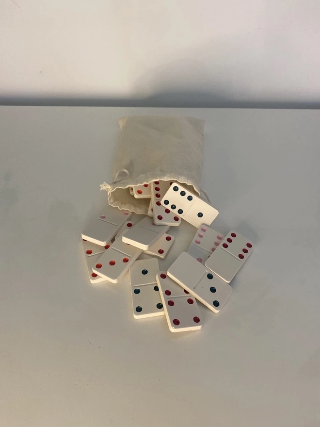 Handmade Valentines And Colourful Jesmonite Dominoes, a group of colourful dominoes on a white surface. 