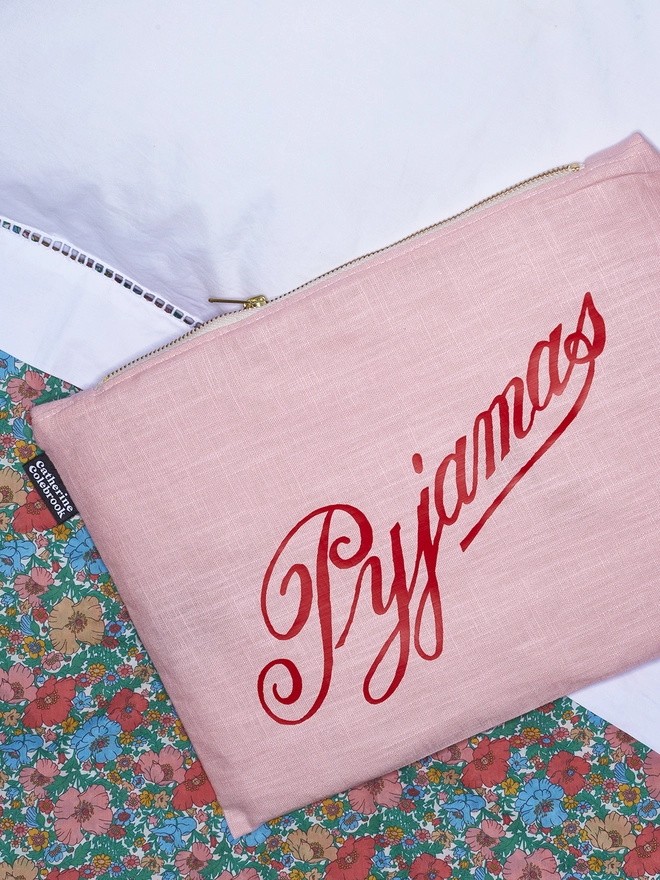 Pink linen with red writing vintage pyjama case