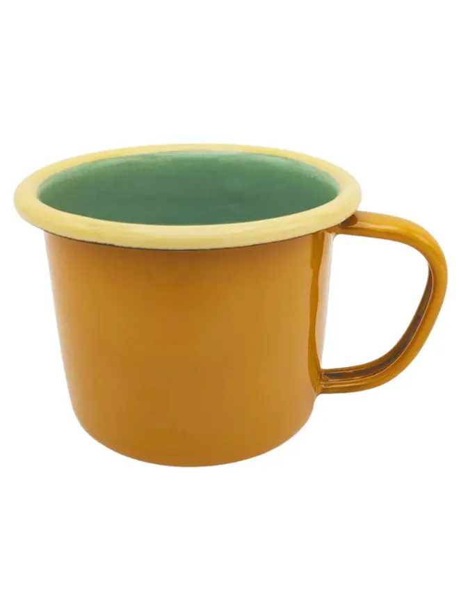 Enamel Mug, an enamel mug sitting on plain white surface. 