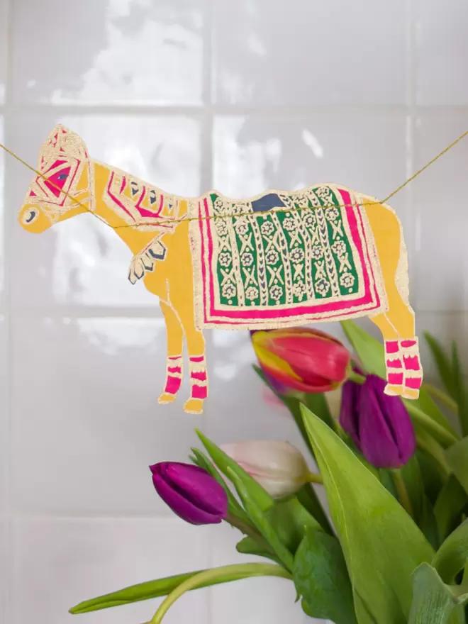 Gold embellished donkey with tulips