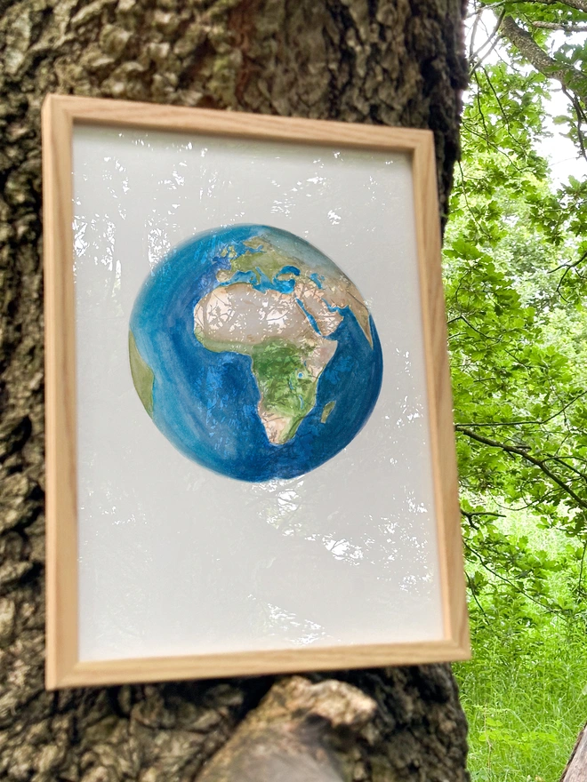 a print featuring an illustration of the globe with europe and africa in view