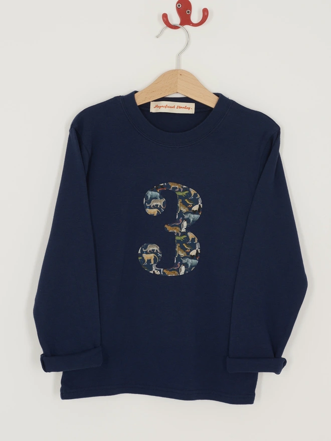 A navy cotton long sleeve t-shirt with a number 3 on the front