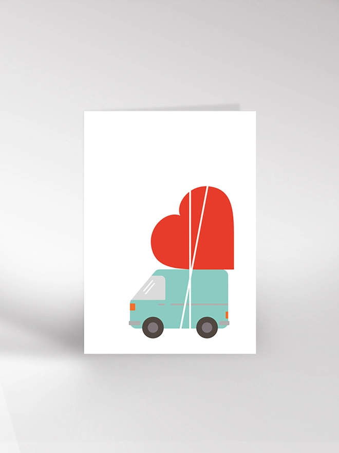 Valentine's or anniversary card featuring a van with a giant heart tied to the roof