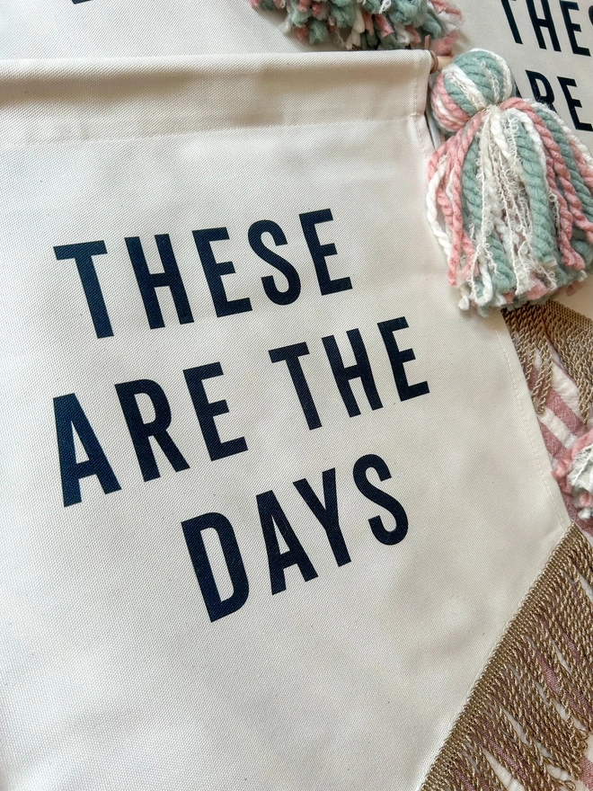 These Are The Days decorative wall hanging banner with tassels