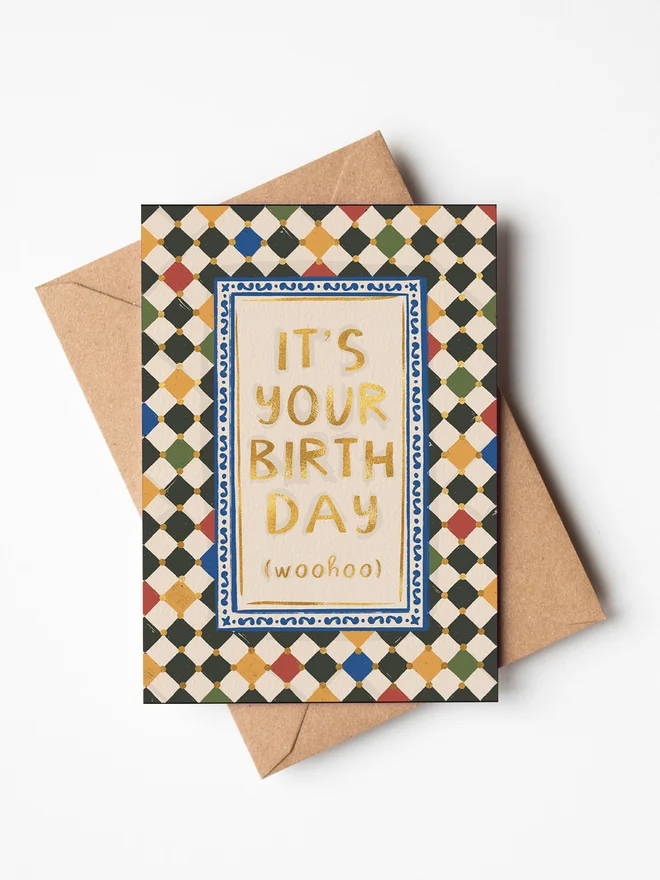'It's your Birthday' checkerboard greeting card on a white background. 