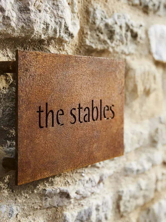 Personalised Garden Sign screwed to a wall