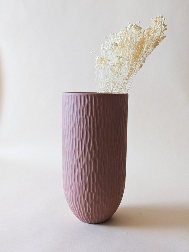 handmade textured pink vase with dried flowers