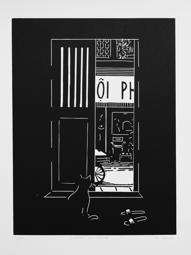 A black and white print depicting a cat watching a street in Vietnam from behind a shutter door. Slippers are by the door and a coffee shop across the road. Done in a simplistic and stylistic way