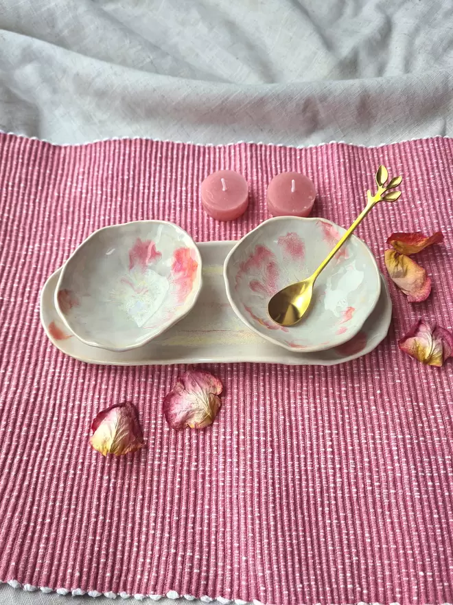 Serveware, Small serving dish crafted from stoneware clay and glazed in Dream Catcher glaze with creams, whites, hints of pink, lilac and specks of metallic gold. Two bowls and an oval dish, tapas dish, snack dish, gift, handmade, homeware, cream background with gold leaves and christmas decorations