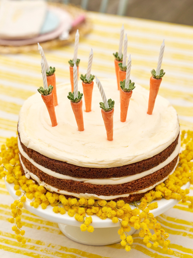 Carrot candle holders on an Easter cake