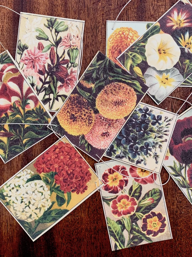 Vintage images of flower seed packets in a pile