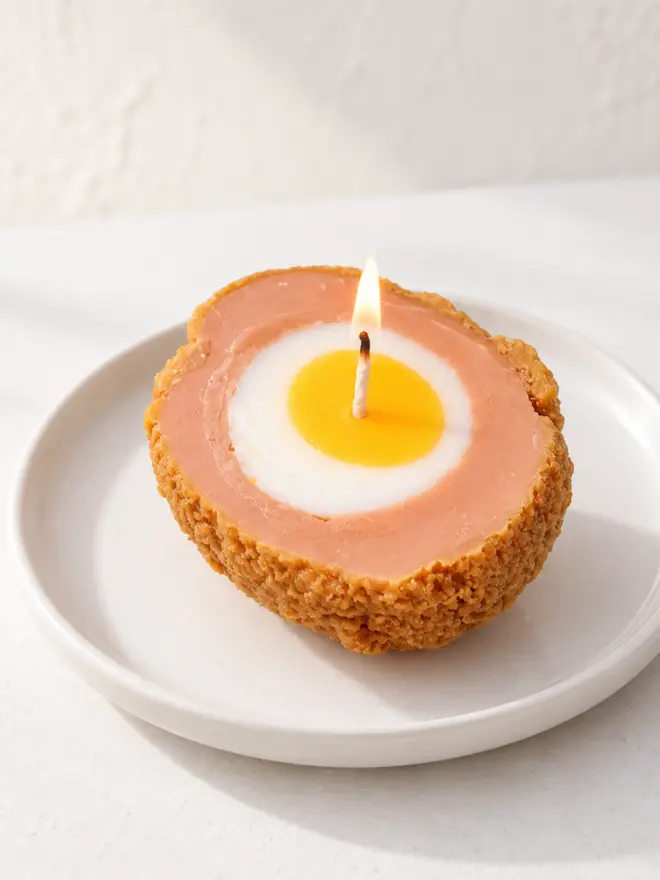 scotch egg candle on a plate