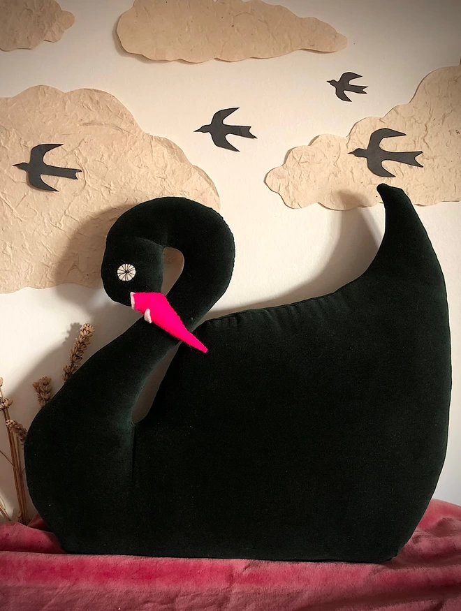 Dark green velvet swan cushion with pink beak 
