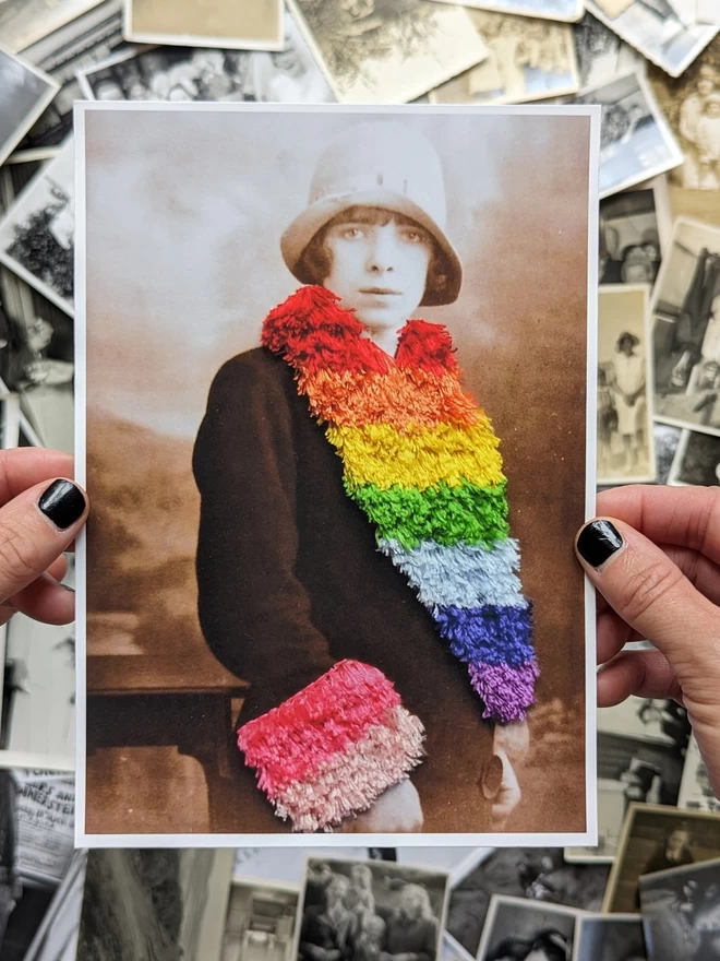  Print of woman wearing embroidered rainbow coloured trim coat held against photos