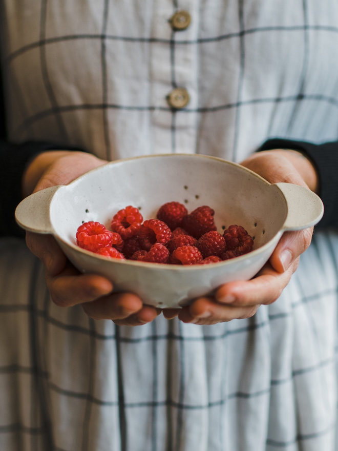 raspberries in handmade stoneware bowl